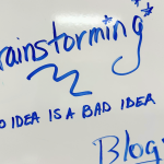 image of brainstorming with dry erase markers on a whiteboard